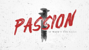 The word "PASSION" in red, distressed text with two dark metal nails behind it and the phrase "IT WASN'T THE NAILS.
